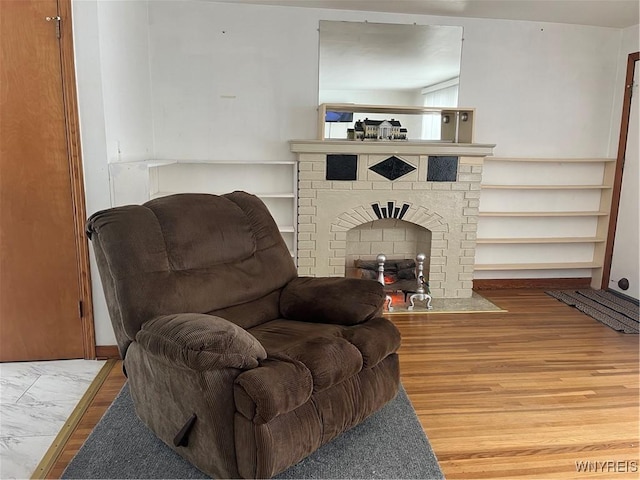 living room with a fireplace and hardwood / wood-style floors