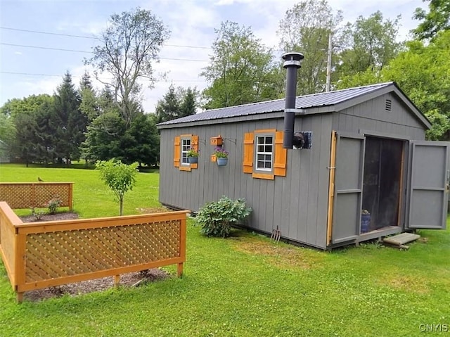 view of outdoor structure with a yard