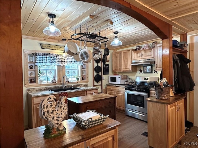 kitchen featuring a center island, sink, wood ceiling, and stainless steel gas stove