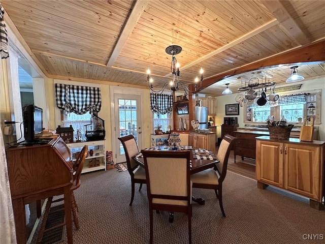 carpeted dining space with beamed ceiling, an inviting chandelier, and wooden ceiling