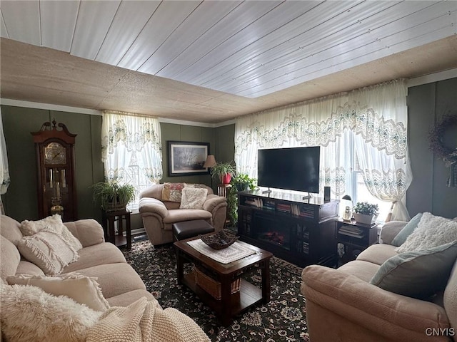 living room with wood ceiling and a wealth of natural light