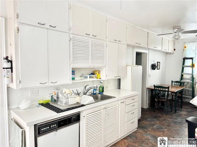 kitchen featuring dishwasher, sink, white cabinets, and ceiling fan