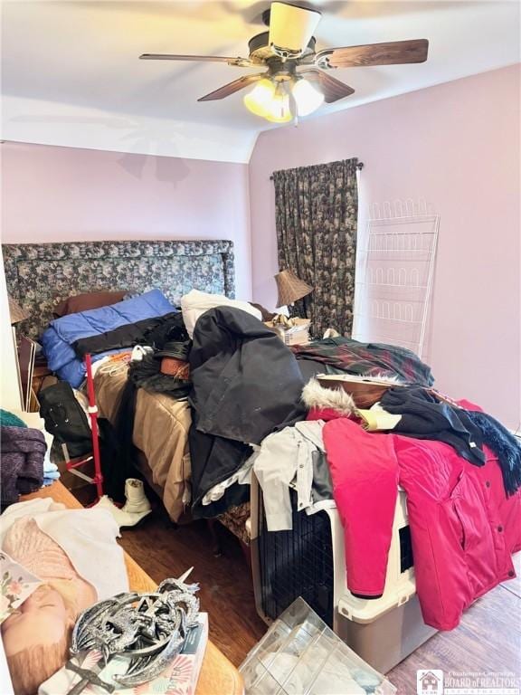 bedroom featuring ceiling fan and wood-type flooring