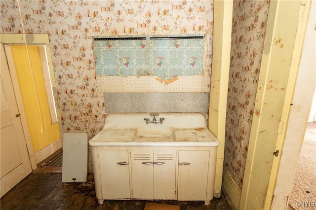 bathroom featuring wallpapered walls