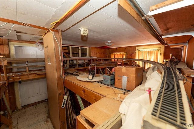 interior space featuring wood walls and tile patterned floors