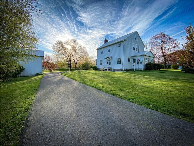 view of property exterior featuring a yard