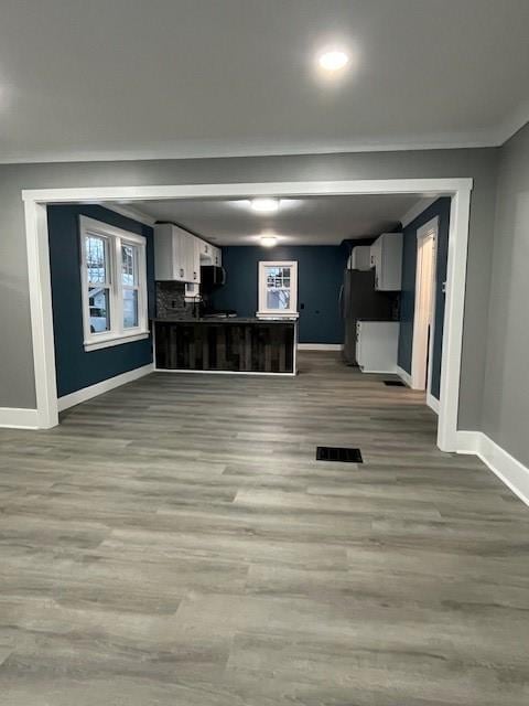 unfurnished living room featuring light wood-type flooring