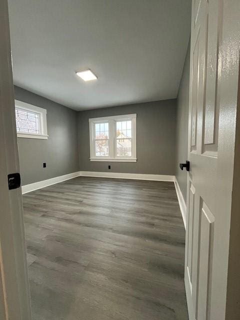 spare room featuring dark hardwood / wood-style flooring