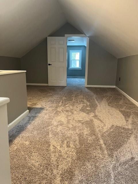 bonus room with carpet and lofted ceiling