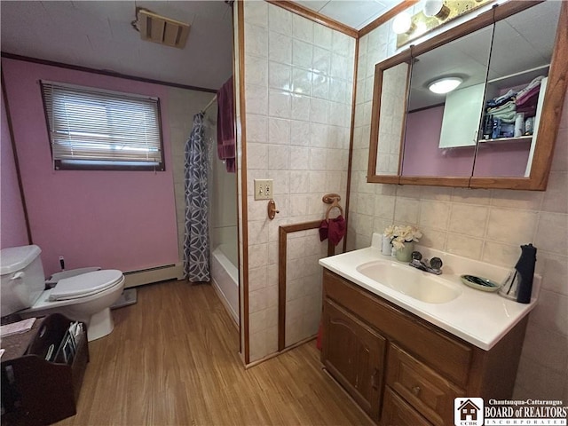 full bathroom featuring tile walls, a baseboard radiator, vanity, shower / bathtub combination with curtain, and hardwood / wood-style flooring