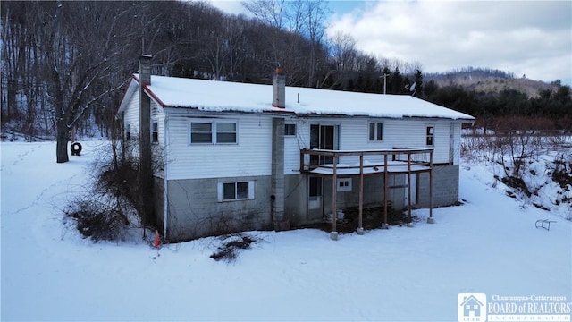 view of snow covered house