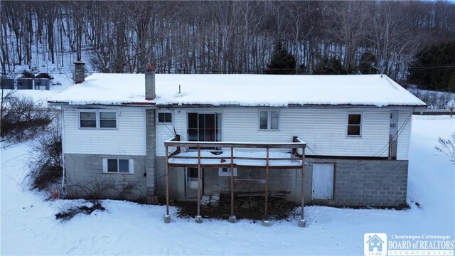 view of snow covered house