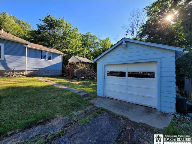 garage with a yard