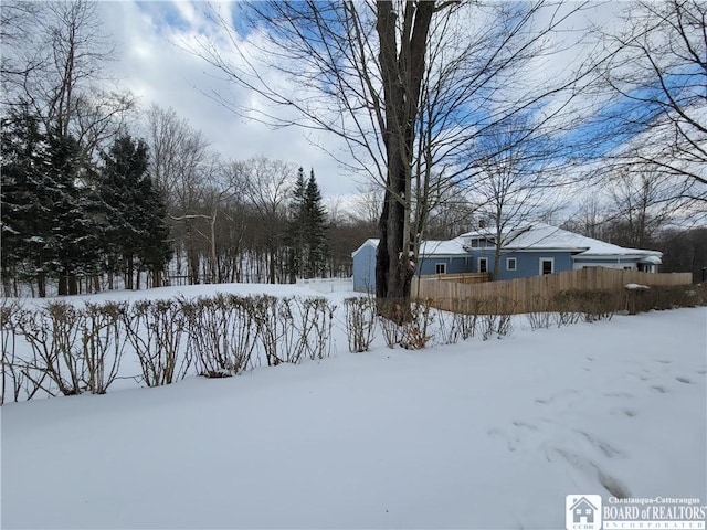 view of yard layered in snow