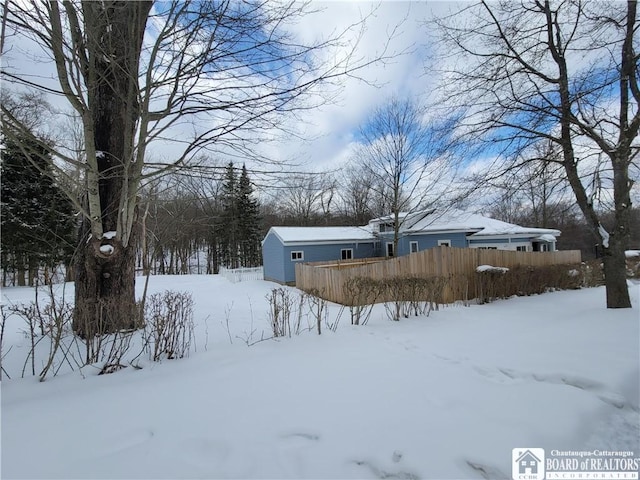 view of yard layered in snow