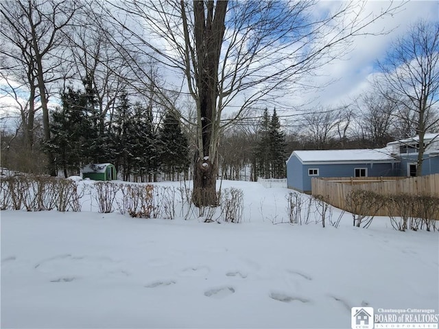 view of yard layered in snow