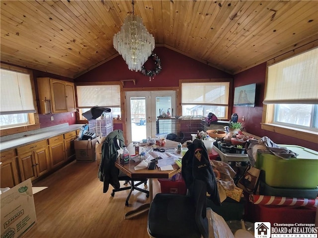 dining area featuring french doors, vaulted ceiling, hardwood / wood-style floors, and wooden ceiling