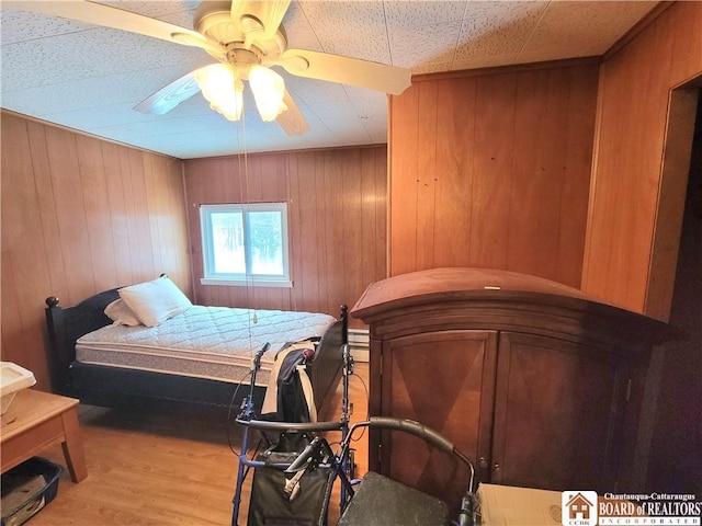 bedroom featuring wood-type flooring and ceiling fan