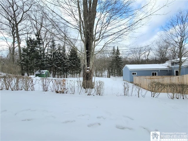 view of yard covered in snow