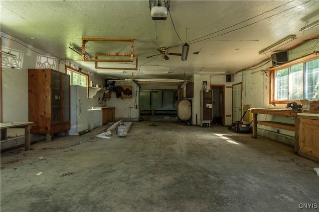 miscellaneous room featuring a workshop area and concrete floors