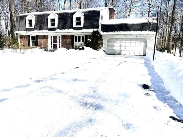 new england style home with a garage