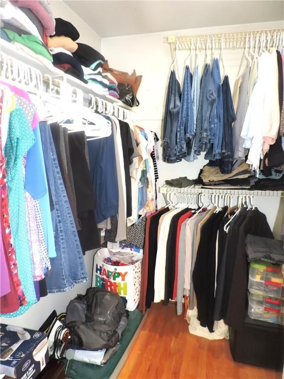 walk in closet featuring dark hardwood / wood-style floors