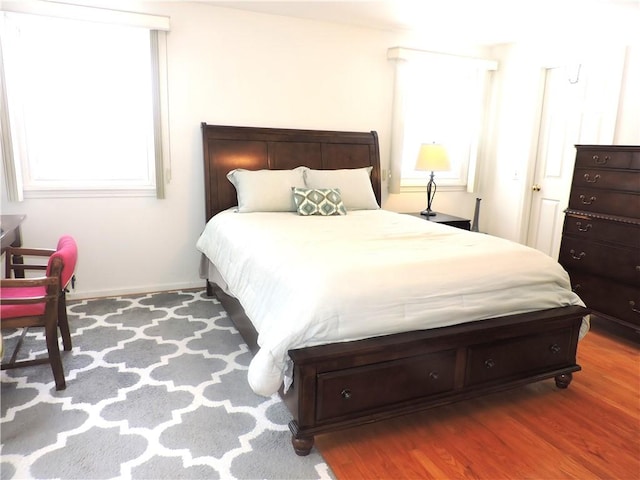 bedroom with wood-type flooring