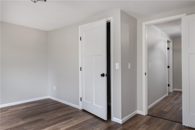 unfurnished bedroom featuring dark hardwood / wood-style floors