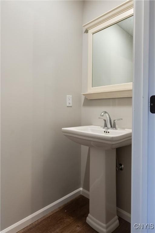 bathroom with wood-type flooring