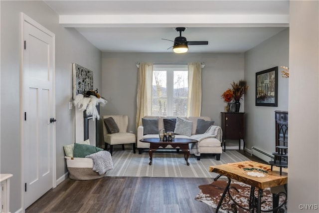 living room featuring a baseboard heating unit, hardwood / wood-style flooring, and ceiling fan