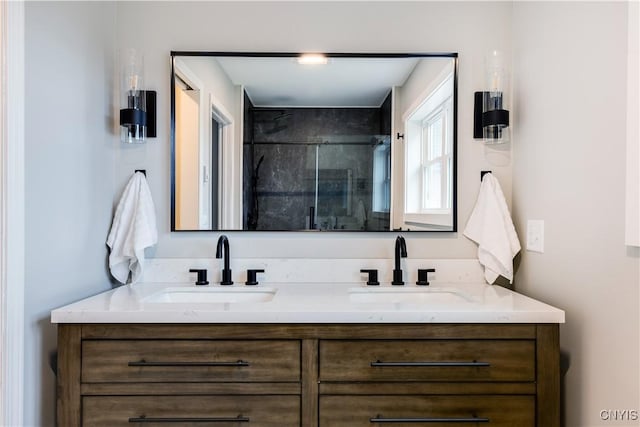 bathroom featuring vanity and a shower with door