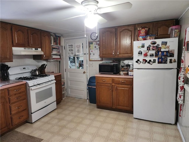 kitchen with white appliances and ceiling fan