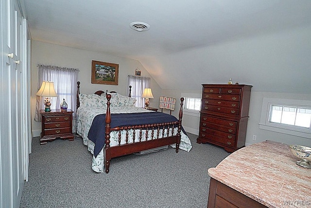 bedroom with carpet and lofted ceiling