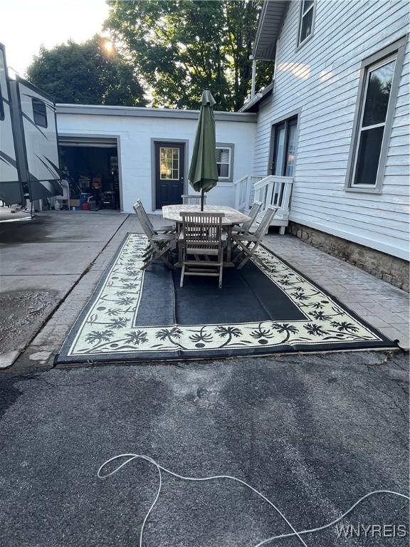 view of patio featuring a garage