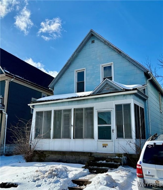 exterior space featuring a sunroom