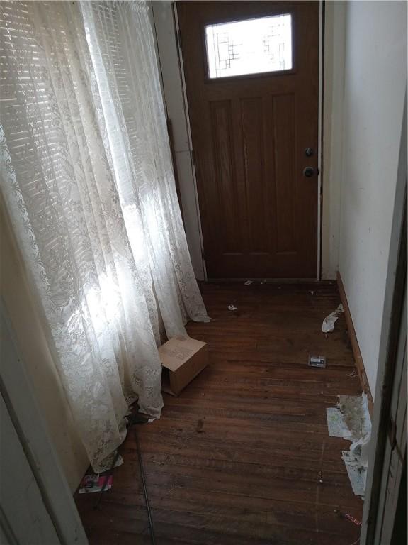 doorway to outside with dark hardwood / wood-style floors