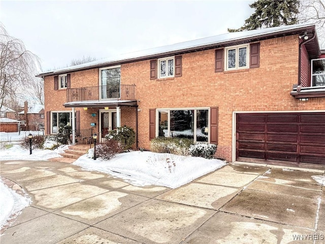 view of front of home featuring a balcony and a garage