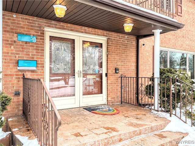 property entrance featuring french doors