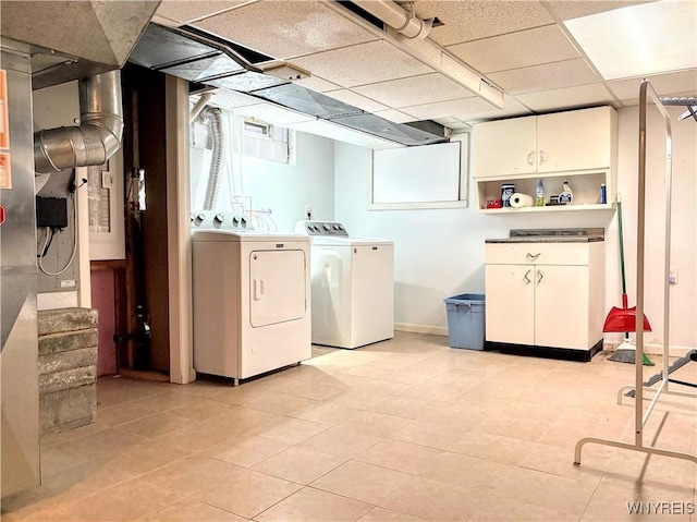 laundry area with cabinets and washer and clothes dryer