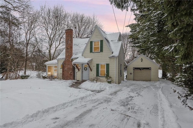 view of front of home featuring a garage and an outdoor structure