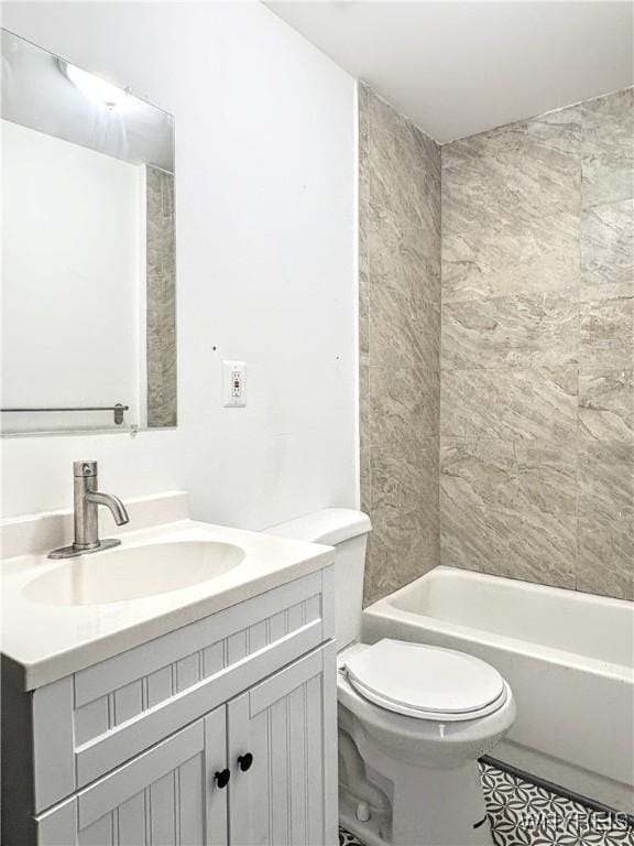 full bathroom featuring vanity, toilet, and tiled shower / bath combo