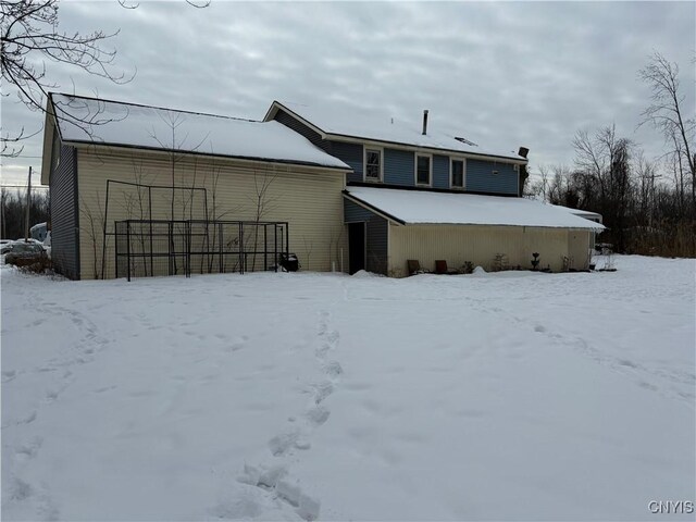 view of snow covered house