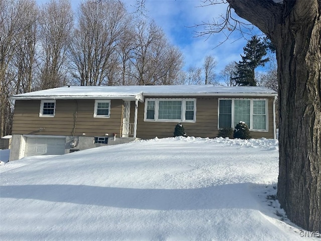 single story home featuring a garage