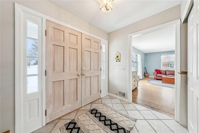 entryway featuring light tile patterned floors