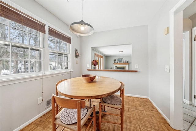 dining room with light parquet floors