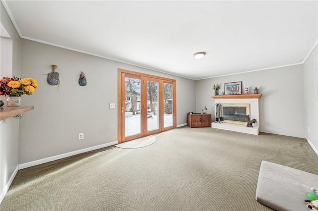 unfurnished living room featuring crown molding, a fireplace, and carpet flooring