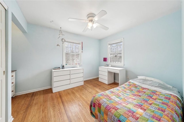 bedroom with ceiling fan and light wood-type flooring