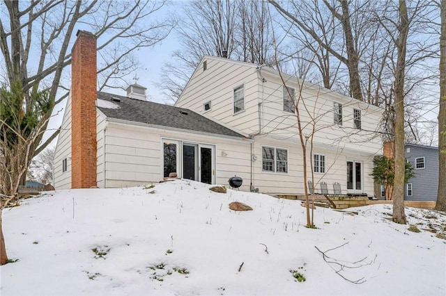 view of snow covered house