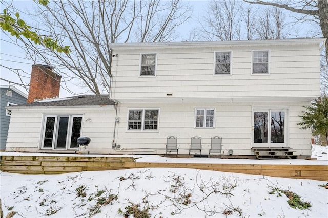 view of snow covered house