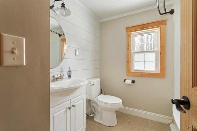 bathroom featuring crown molding, vanity, toilet, and tile patterned flooring